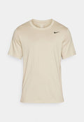 Nike Performance TEE CREW SOLID - Sports T-shirt - desert khaki black