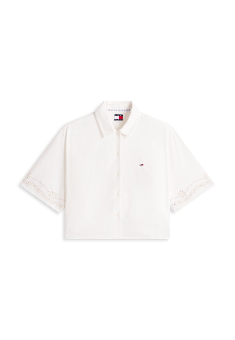 Weißes Kurzarm-Hemd mit Knopfleiste und Kragen, dezente bestickte Ärmelränder und ein kleines Tommy Hilfiger Logo auf der Brust.