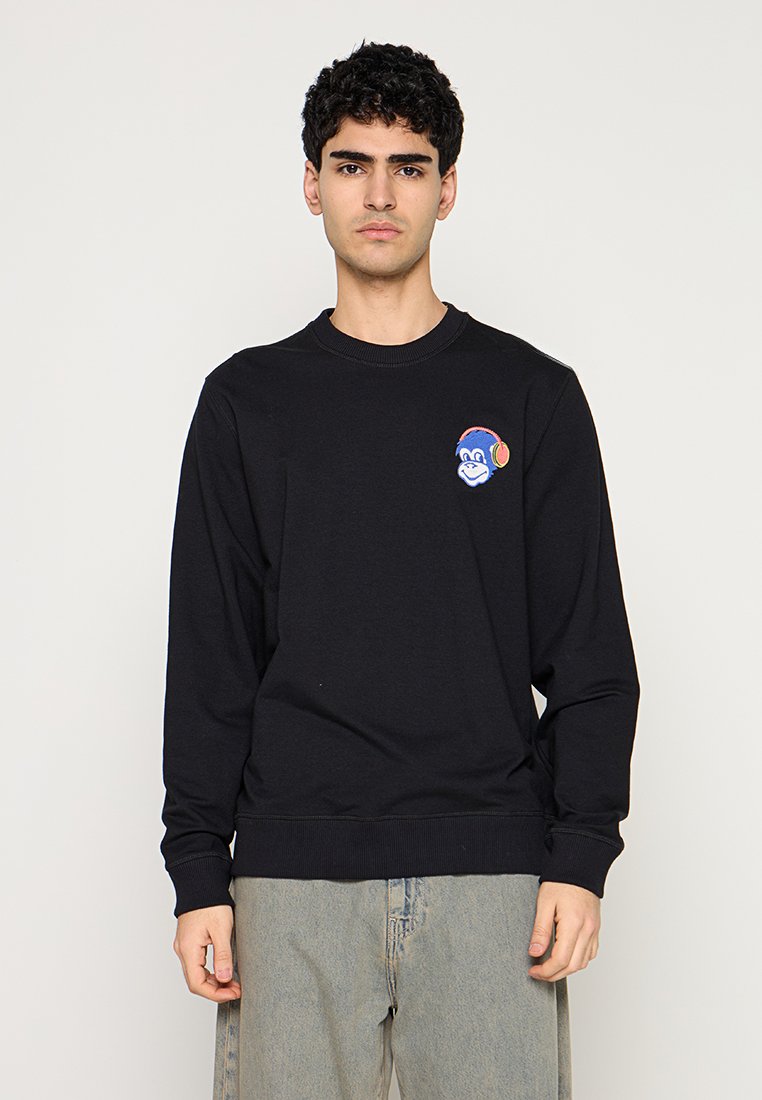 Schwarzer Sweatshirt aus Baumwolle mit einem bunten, auf der Brust bestickten Affendesign. Lange Ärmel und gerippter Saum.