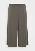 Graue weit geschnittene Hosen aus leichtem Stoff, mit einem elastischen Bund und einer glatten Textur. Geeignet für den Freizeitlook.