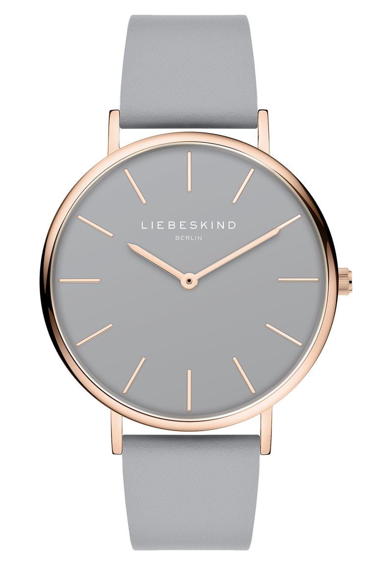 Runde Uhr mit einem grauen Zifferblatt und minimalistischen roségoldenen Stundenmarkierungen. Verfügt über ein weiches graues Lederarmband und einen eleganten vergoldeten Gehäuserand.