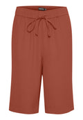 Rostfarbene Shorts mit elastischem Bund, Kordelzug und glatter Textur. Fallen bis zur Mitte des Oberschenkels mit einem lockeren Schnitt und gesäumten Bündchen.