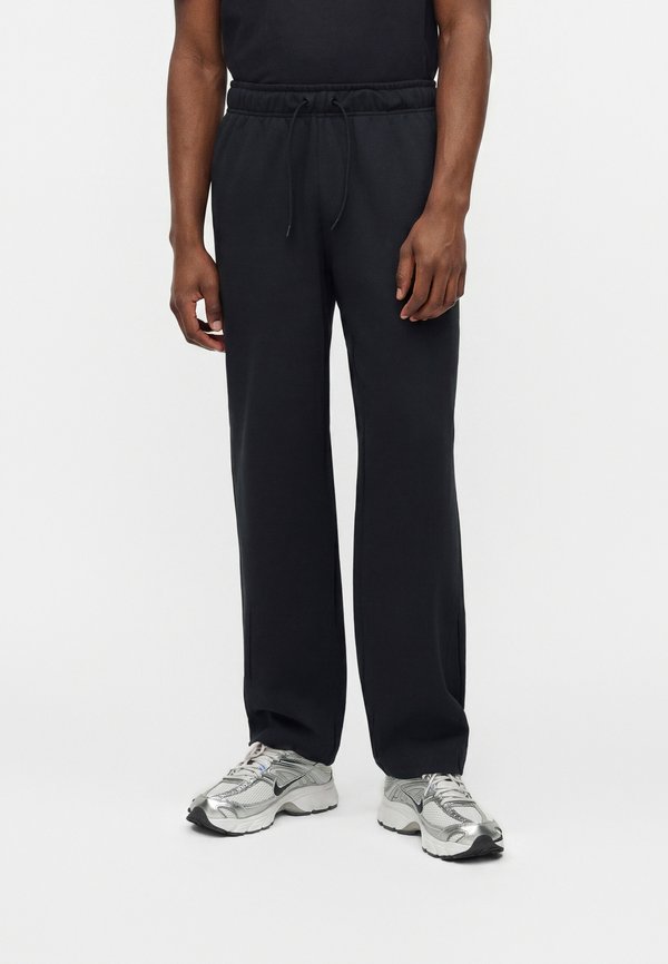 Nike Sportswear CLUB VARSITY PANT - Tracksuit bottoms - black/white