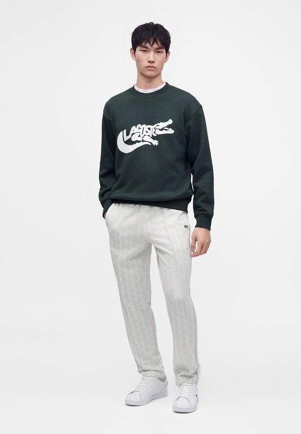 Lacoste UNISEX - Tracksuit bottoms - patisson/flour