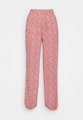 Rote Blumenmuster-Hosen mit weitem Bein, elastischem Bund und leichtem Stoff. Verfügt über kleine weiße Blumenmuster überall.
