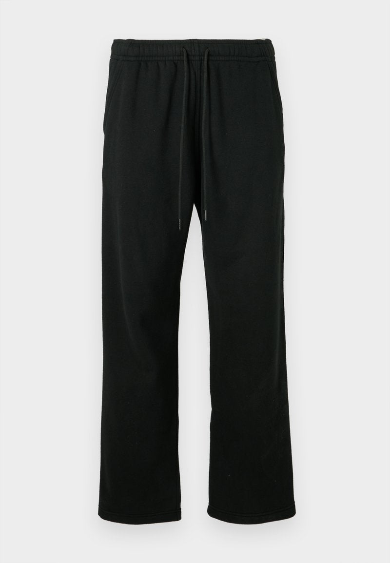 Schwarze Jogginghosen aus weichem Material, mit Kordelzugbund, lockerer Passform und geradem Bein. Keine Taschen oder Muster.