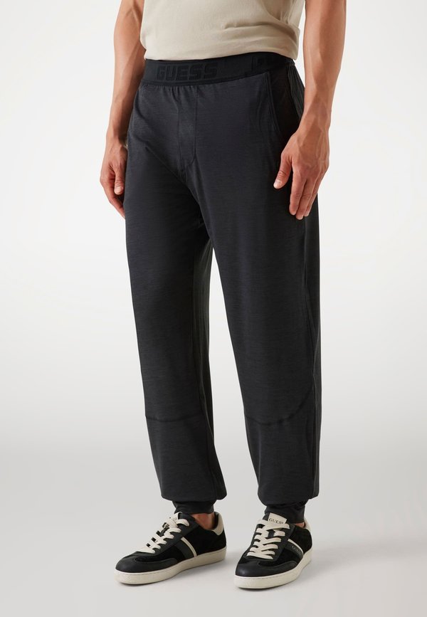 Guess REGULAR FIT - Tracksuit bottoms - schwarz
