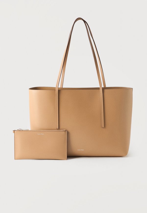 Calvin Klein FOIL LOGO TOTE POUCH - Tote bag - beige