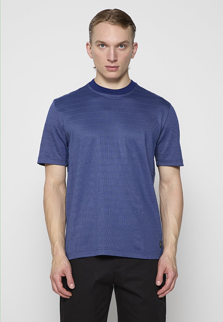 Kurzärmliges navyblaues Hemd aus strukturiertem Stoff mit Rundhalsausschnitt. In gerader Passform mit minimalen Details am Saum gestaltet.