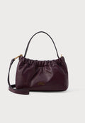 Tommy Hilfiger SOFT LEATHER LOGO PLAQUE CROSSBODY BAG - Handbag - marzemino
