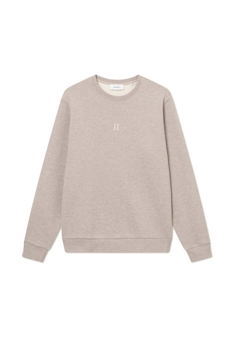Helle beigetönige Sweatshirt aus weichem Stoff, mit Rundhalsausschnitt, langen Ärmeln und einem kleinen gestickten Design auf der Brust.