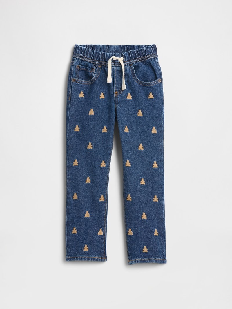 Blaue Jeanshose für Kinder mit elastischem Bund, weißer Kordel, Vordertaschen und einem Stickmuster mit Teddybären über die Beine.