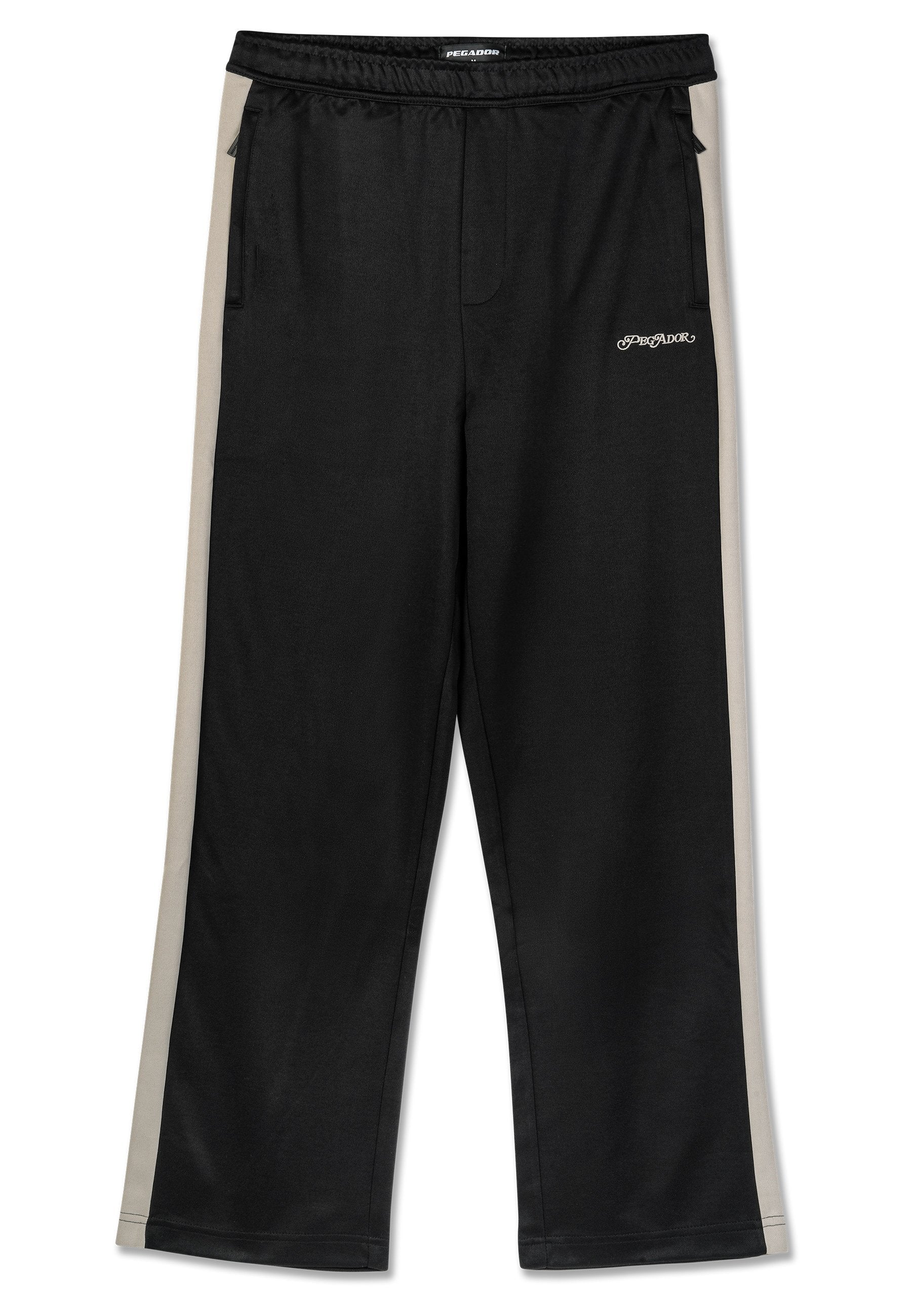 Schwarze Sporthosen mit beigefarbenen Seitenstreifen, elastischem Bund, zwei Fronttaschen und einer glatten Stoffstruktur. Mit Markenlogo.