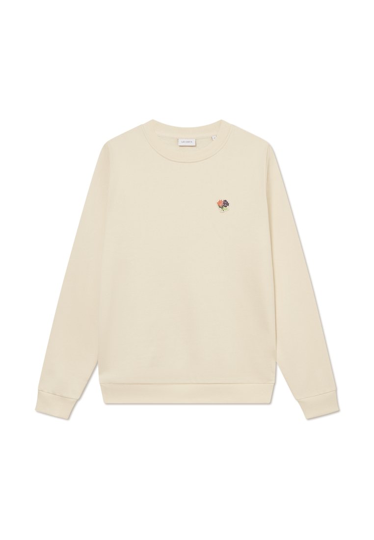 Cremfarbener Pullover mit langen Ärmeln, gerippten Bündchen und Saum. Enthält eine kleine florale Stickerei im linken Brustbereich.