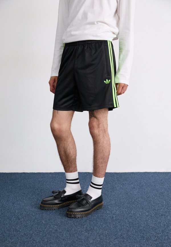 adidas Originals Tracksuit bottoms - black/signal green