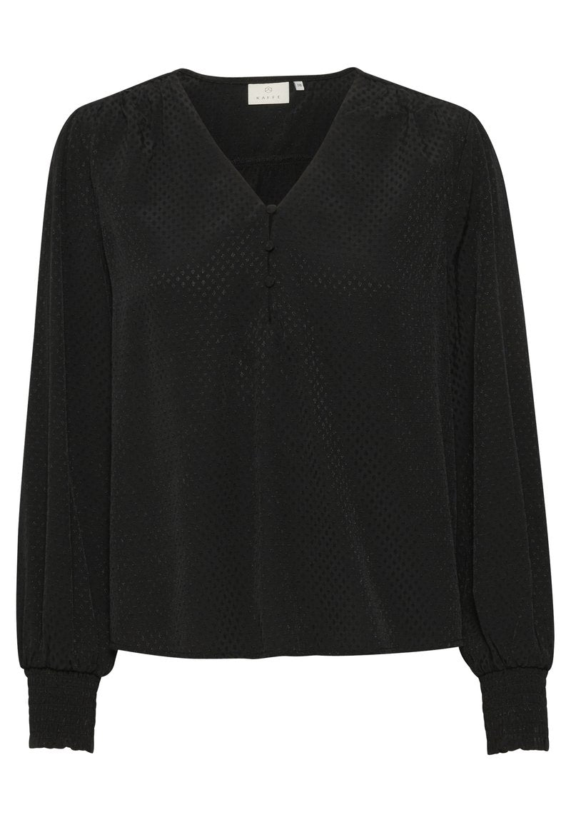 Schwarze Bluse mit langen Puffärmeln, V-Ausschnitt, drei-Knopf-Detail vorne und strukturiertem Stoff mit kleinen Punktmustern.