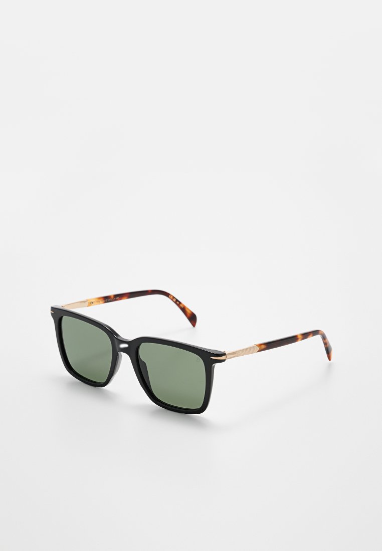 Schwarze und schildpattfarbene Sonnenbrille mit grünen Gläsern, quadratischem Rahmen und goldenen Metallelementen an den Bügeln. Strukturiertes Detail auf den Armteilen.