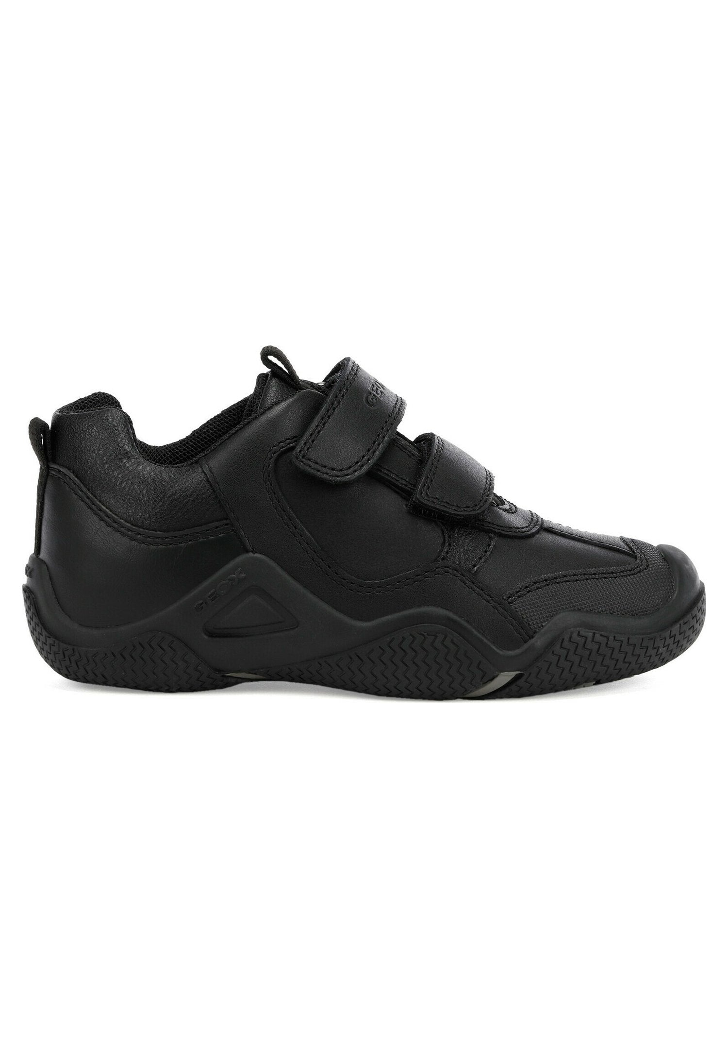 Schwarze sportive Schuhe aus Leder und synthetischen Materialien, mit einem niedrigen Design, zwei verstellbaren Klettverschlüssen und einer strukturierten Gummisohle.