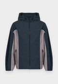 Marineblaue und graue Kapuzenjacke mit Frontreißverschluss, seitlichen Reißverschlusstaschen und elastischen Bündchen.
