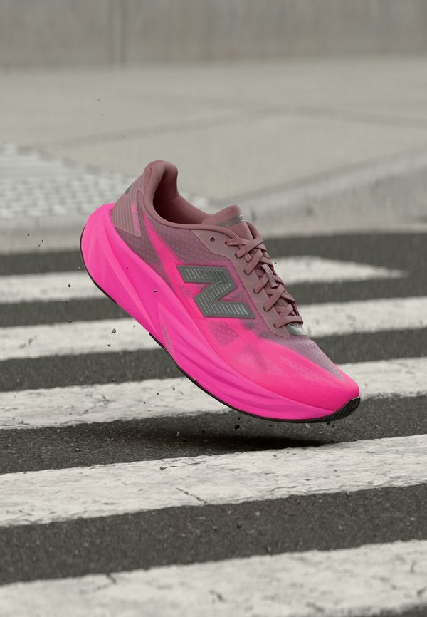New Balance FUELCELL REBEL V5 - Road running shoes - pink heat