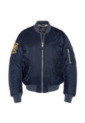 Navyblaues Bomberjackett aus glänzendem Nylon, mit Reißverschluss vorne, gerippten Bündchen, zwei Seitentaschen und einem Patch auf dem linken Ärmel.