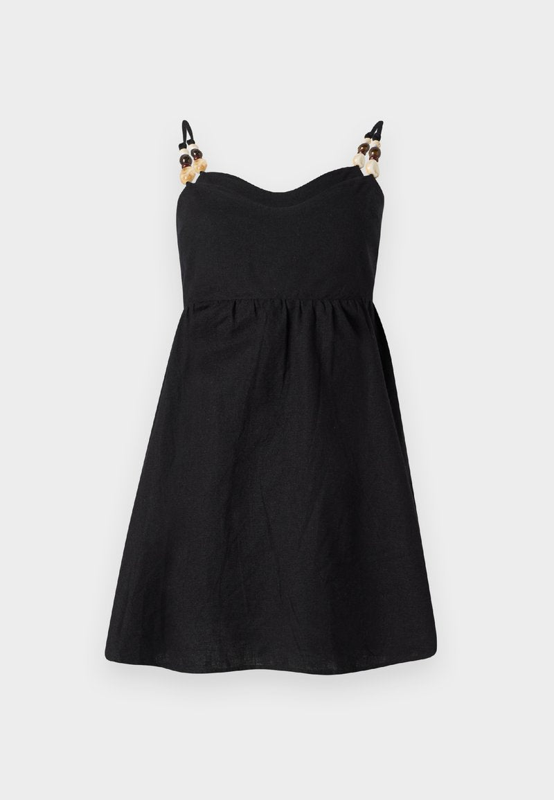 Schwarzes Leinenkleid mit tailliertem Oberteil und ausgestelltem Rock. Schmales Trägerdesign verziert mit dekorativen Perlen an den Schultern. Glatte Textur.