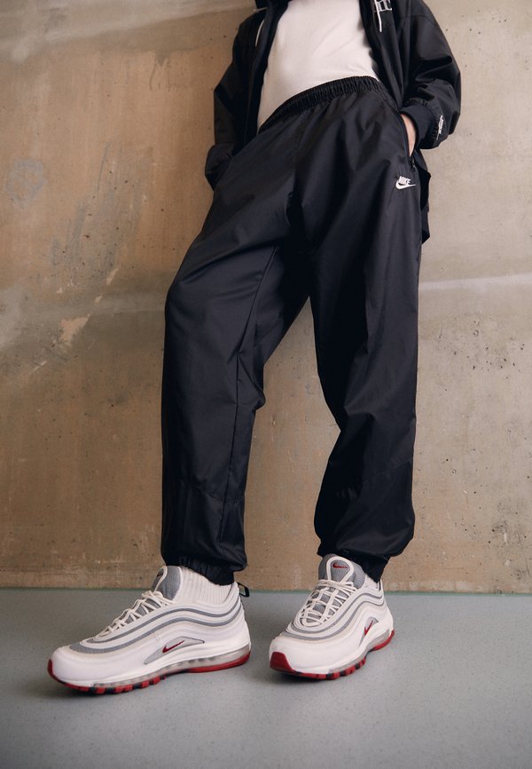Nike Sportswear WINDRUNNER - Tracksuit bottoms - black/white