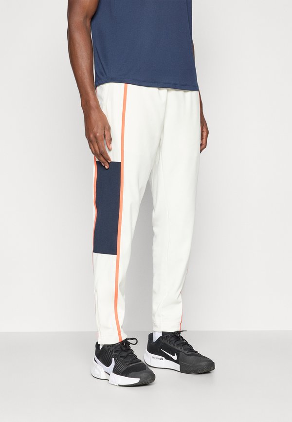 Nike Performance HERITAGE  - Tracksuit bottoms - sail/turf orange