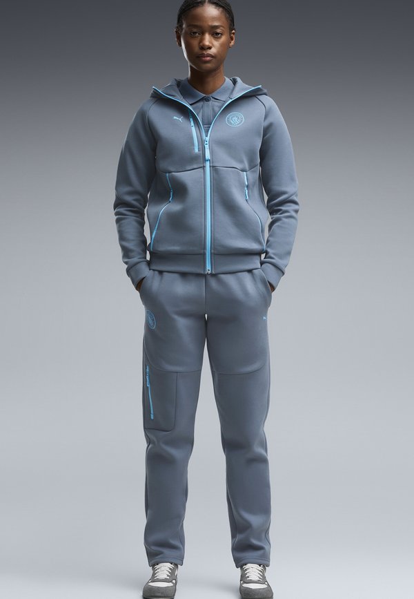 Puma MANCHESTER CITY PUMATECH JOGGINGHOSE - Tracksuit bottoms - evening sky-luminous blue
