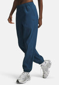 Under Armour UNSTOPPABLE WOVEN - Tracksuit bottoms - wham blue (498)