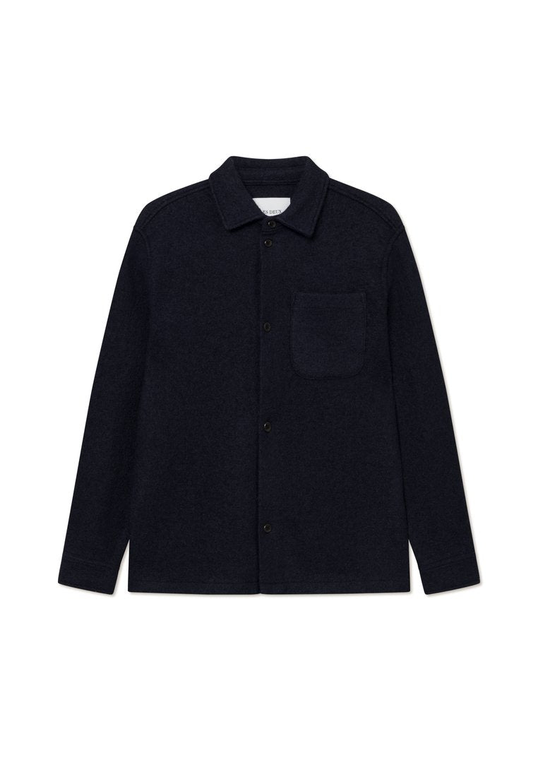 Marineblaue Wollhemdjacke mit langen Ärmeln, Knopfleiste und linkem Brusttasche. Mit klassischem Kragen und strukturiertem Stoff.