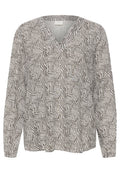 Langärmelige Bluse mit V-Ausschnitt, aus leichtem Stoff gefertigt, mit einem geometrischen schwarz-weißen Muster, das geschwungene und gestreifte Designs umfasst.