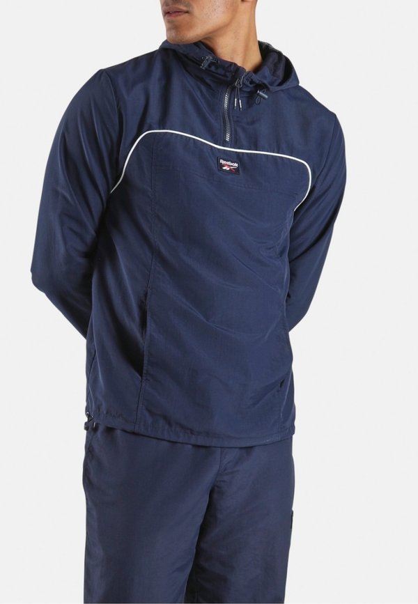 Reebok OVERHEAD WINDCHEATER-BLUE . - Outdoor jacket - vector navy