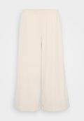 Helle beige weit geschnittene Hose aus weichem Stoff. Verfügt über einen elastischen Bund und eine glatte Textur. In Knöchellänge geschnitten.