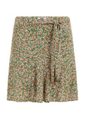 Blumiger Rock in Grün mit orangefarbenen und weißen Blumen. Leichter Stoff mit einem Bindeband in der Taille und ausgestellt geschnittenem Saum.