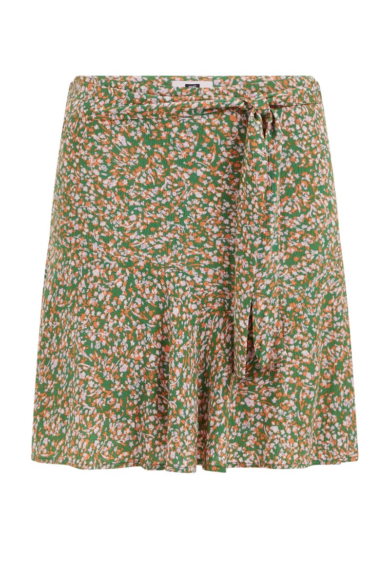 Blumiger Rock in Grün mit orangefarbenen und weißen Blumen. Leichter Stoff mit einem Bindeband in der Taille und ausgestellt geschnittenem Saum.