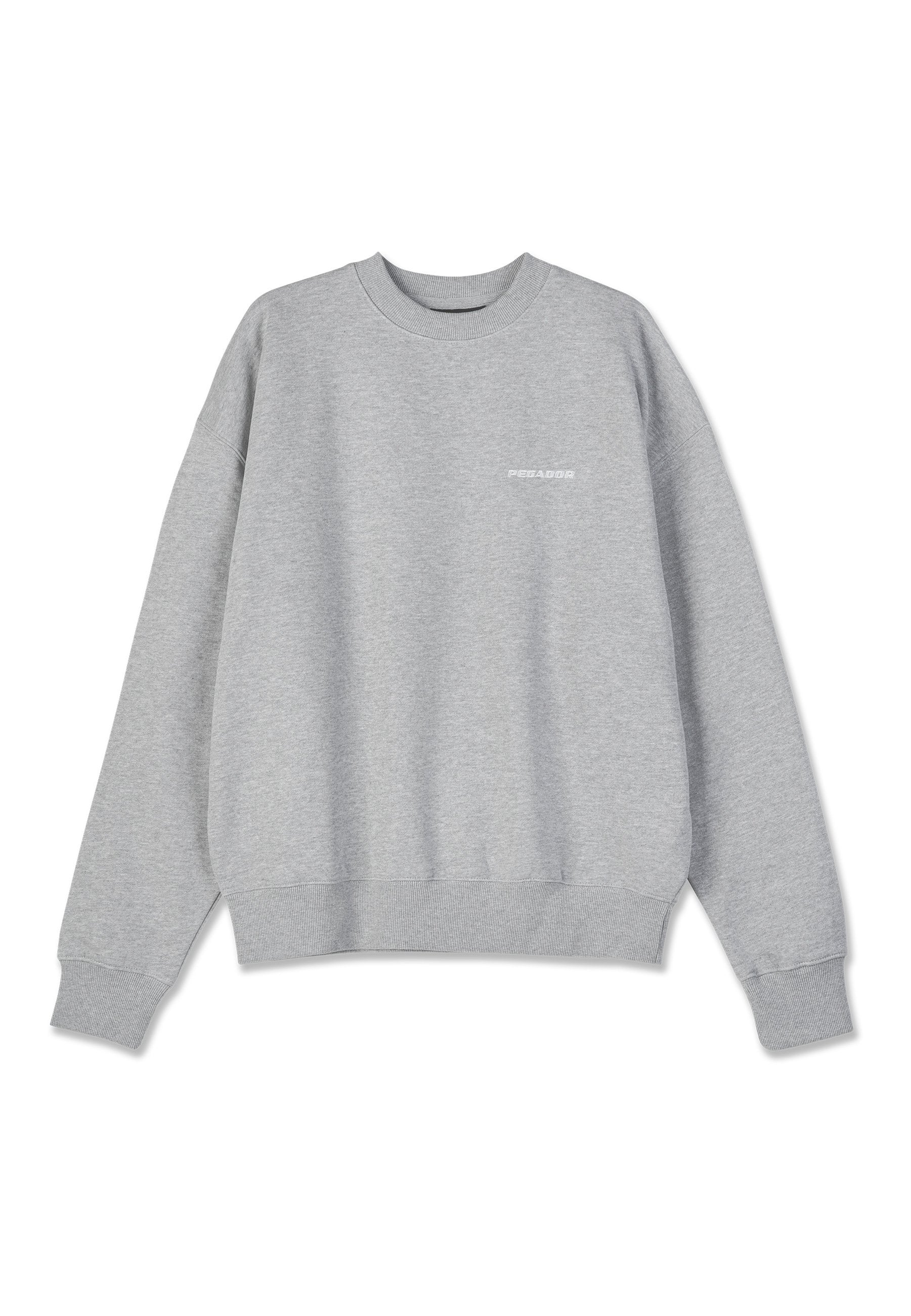 Grauer Sweatshirt aus Baumwollmischung. Rundhalsausschnitt, lange Ärmel, gerippte Bündchen und Saum. Mit einem kleinen weißen Logo auf der Vorderseite.