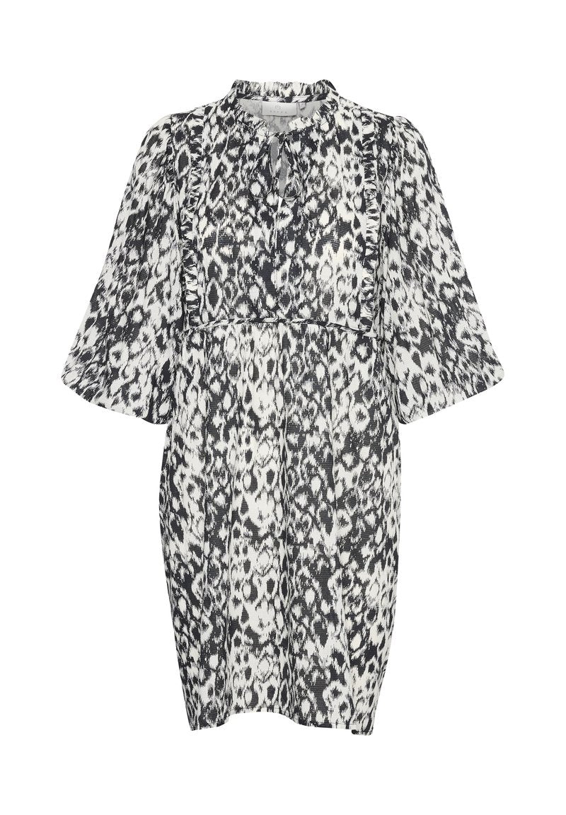 Schwarz-weißes Leopardenmuster-Kleid mit gerafftem Oberteil, ausladenden Ärmeln und einer Schleifenverschluss am Hals. Leichter Stoff mit strukturierter Oberfläche.