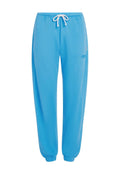 Blaue Jogginghosen aus weichem Stoff, mit einem elastischen Bund und verstellbarem Kordelzug sowie elastischen Bündchen an den Knöcheln.