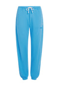 Blaue Jogginghosen aus weichem Stoff, mit einem elastischen Bund und verstellbarem Kordelzug sowie elastischen Bündchen an den Knöcheln.