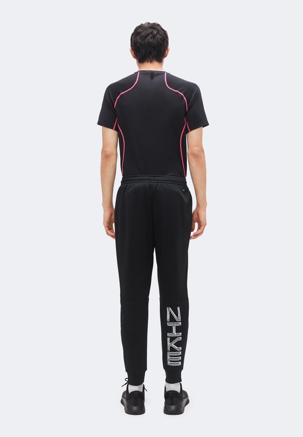 Nike Performance FLEX - Tracksuit bottoms - black/white