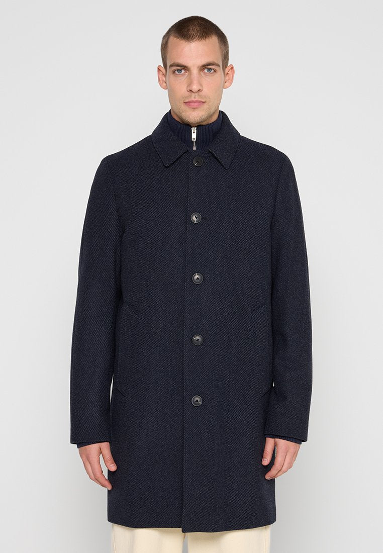 Marineblaue Wollmischung Mantel mit Kragen, fünf vorderen Knöpfen, zwei seitlichen Taschen und einer strukturierten Oberfläche. Verfügt über einen Reißverschluss und eine taillierte Passform.