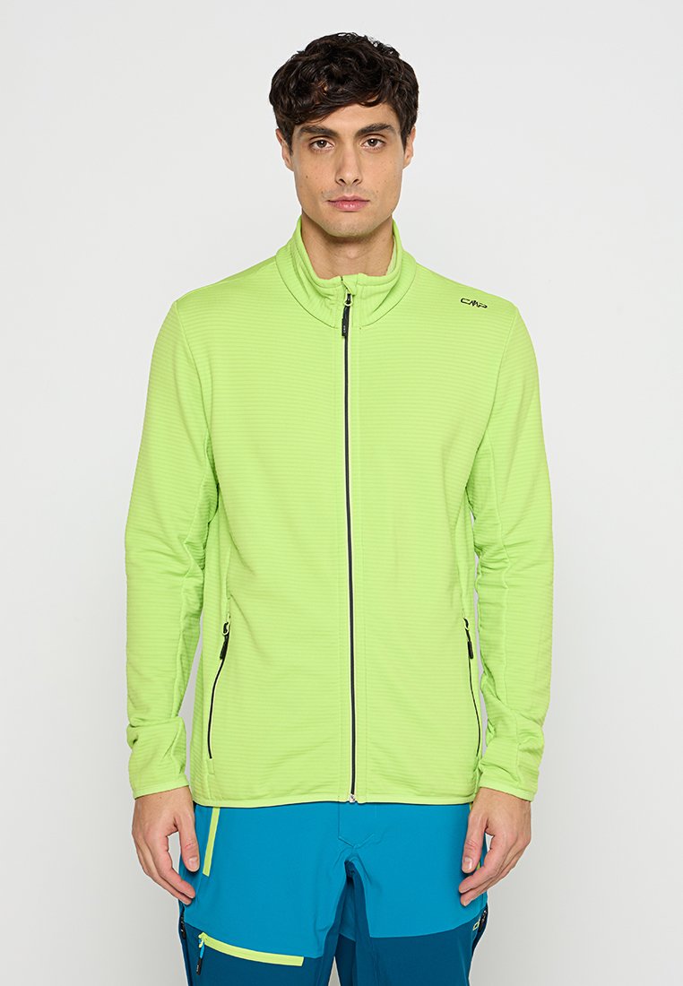 Grüne Zip-Jacke aus strukturiertem Stoff, mit Seitentaschen und hohem Kragen. Der Reißverschluss hat einen kontrastierenden schwarzen Pull.