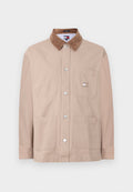 Beige Knopfjacke mit braunem Cordkragen, Brusttasche mit Tommy Jeans-Logo und zwei unteren Fronttaschen.