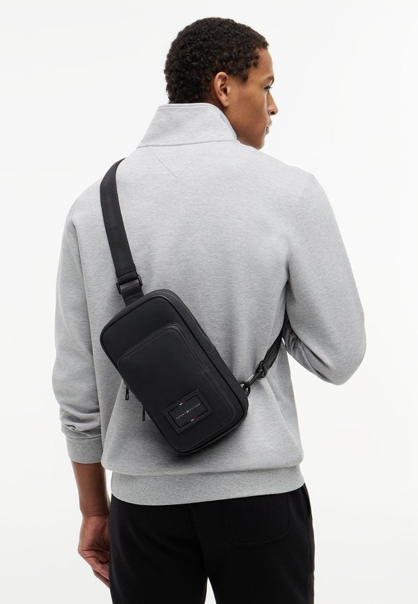 Tommy Hilfiger FOUNDATION SLING PACK UNISEX - Cross body bag - black