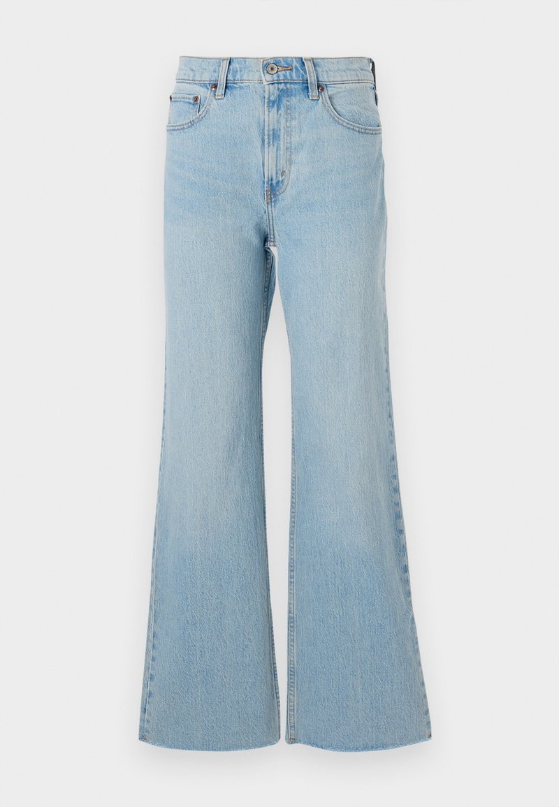 Helle blaue Jeans im Schlagstil mit hoher Taille, ausgestattet mit einem klassischen Knopf- und Reißverschluss und leichter Ausbleichung im gesamten Stoff.