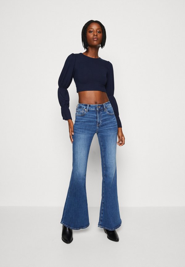WAL G. SARA BACKLESS TOP