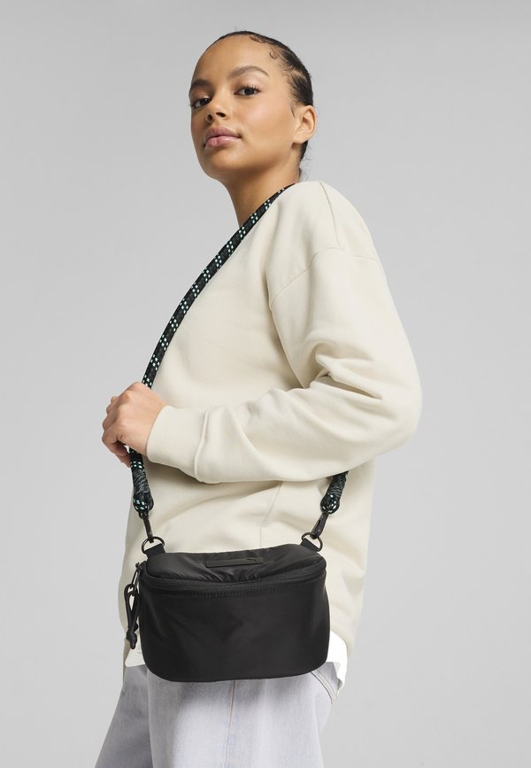 Puma XTRME KLEINE - Cross body bag - black