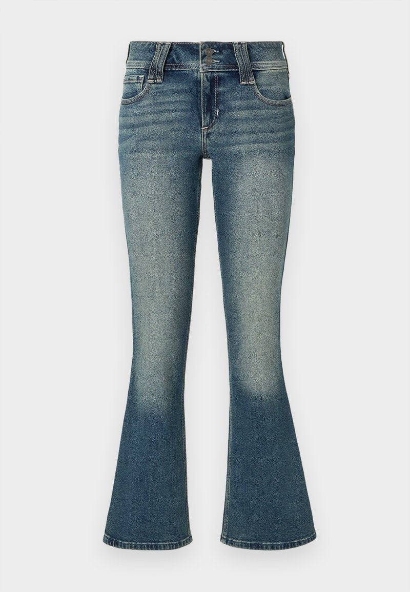 Mittenblaue Denim-Jeans mit leichtem Ausbleichen an den Oberschenkeln und weit geschnittenen Beinen, ausgestattet mit Fronttaschen, Gürtelschlaufen und einem doppelt geknöpften Verschluss.
