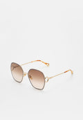 Goldfarbene Metallsonnenbrille mit einem markanten geometrischen Design, braunen Verlaufsgläsern und dekorativen Akzenten am Gestell und an den Bügeln.